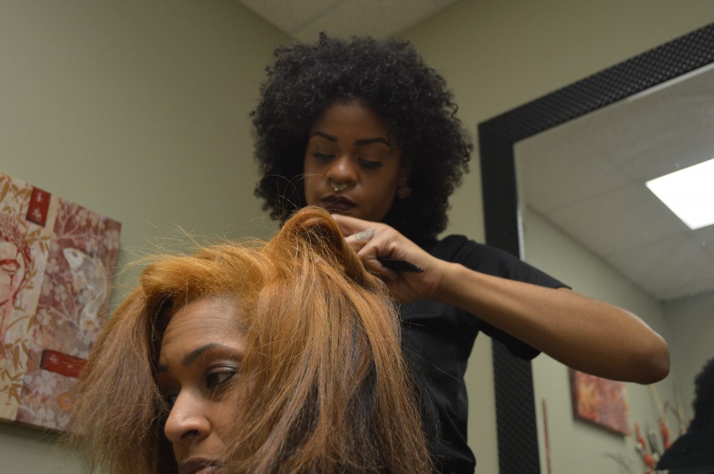 Charlie Maxine prepares to do a blowout to a clients hair. Clarie is a natural stylist at Natural Elements in Homewood. JOSEPH KENNEDY PHOTOS, SPECIAL TO THE TIMES.