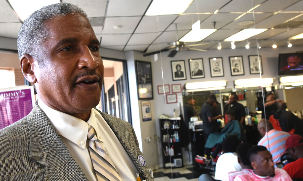 Michael Lundy, HABD president and CEO, used the barbershop to kick off the housing Authority's annual Fatherhood initiative.
