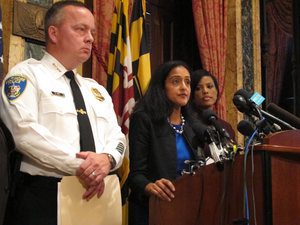 Vanita Gupta, head of the Justice Department's Civil Rights Division, discusses the department's findings on the investigation into the Baltimore City Police Department as Police Commissioner Kevin Davis, left, and Mayor Stephanie Rawlings-Blake, right, listens on Wednesday, Aug. 10, 2016 at City Hall in Baltimore. (Brian Witte, Associated Press) 