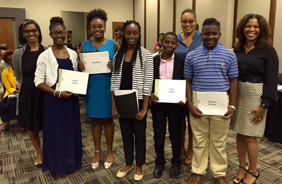 From left: Dr. Stephanie Yates of UAB; Lauryn Green of W.J. Christian; Nyla Boler of Phillips Acadmy; Shelbe Arrington of Phillips Academy; Tyler Collins of Huffman Middle School; Zhaundra Jones of Operation HOPE; Tamauri Murray of Wilkerson Middle School and Superintendent Dr. Kelley Castlin-Gauctan. (Chanda Temple, Birmingham City Schools)