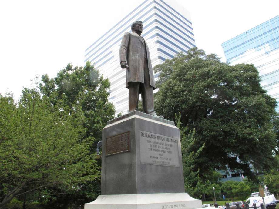 In this July 17, 2015 file photo, the statue honoring former South Carolina governor and U.S. senator "Pitchfork" Ben Tillman is seen on the grounds of the Statehouse in Columbia, S.C. Authorities are investigating Monday, Nov. 14, 2016, after someone left black nylon stockings filled with dirt hanging from tree branches outside a South Carolina University hall named for an avowed racist. A Winthrop University Police report says 12 stockings were found Sunday outside Tillman Hall, with a sign taped over a plaque reading "Tillman's Legacy." (AP Photo/Jeffrey Collins, File)