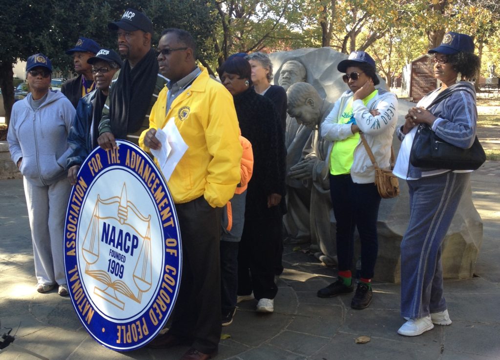Alabama NAACP president (yellow jacket) Bernard Simelton encouraged citizens to not shop on Black Friday and expressed concerned about Sen. Jeff Sessions as the U.S. Attorney General. (Monique Jones, The Birmingham Times)