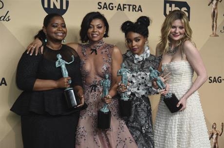 Octavia Spencer, from left, Taraji P. Henson, Janelle Monae, and Kirsten Dunst pose in the press room with the award for outstanding performance by a cast in a motion picture for "Hidden Figures" at the 23rd annual Screen Actors Guild Awards at the Shrine Auditorium & Expo Hall on Sunday, Jan. 29, 2017, in Los Angeles. (Jordan Strauss/Invision/AP)