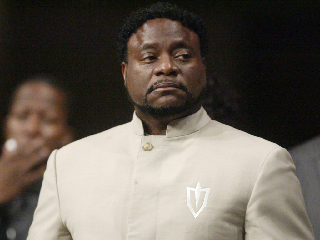 In a Sunday, Sept. 26, 2010 file photo, Bishop Eddie Long prepares to speak, at New Birth Missionary Baptist Church near Atlanta. Long, a prominent pastor who led one of metro Atlanta's largest churches, died Sunday, Jan. 15, 2017, the New Birth Missionary Baptist Church said in a statement to local media outlets.  He was 63.  (AP Photo/John Amis, Pool, File)