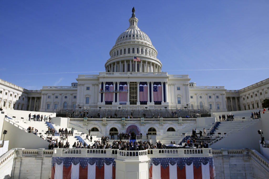 In this Jan. 15, 2016, photo, the U.S. Capitol frames the backdrop over the stage during a rehearsal of President-elect Donald Trump's swearing-in ceremony in Washington. Some two dozen House Democrats plan to boycott Trump’s inauguration on Friday, casting the Republican businessman as a threat to democracy. (AP Photo/Patrick Semansky)