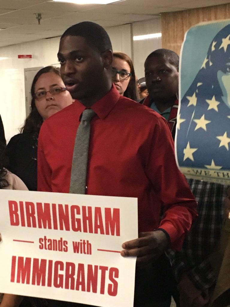 Carlos Chaverst of the Birmingham chapter of the National Action Network speaks to the press during an impromptu press conference after the City Council passes the resolution to declare Birmingham a sanctuary city. (Monique Jones, The Birmingham Times)