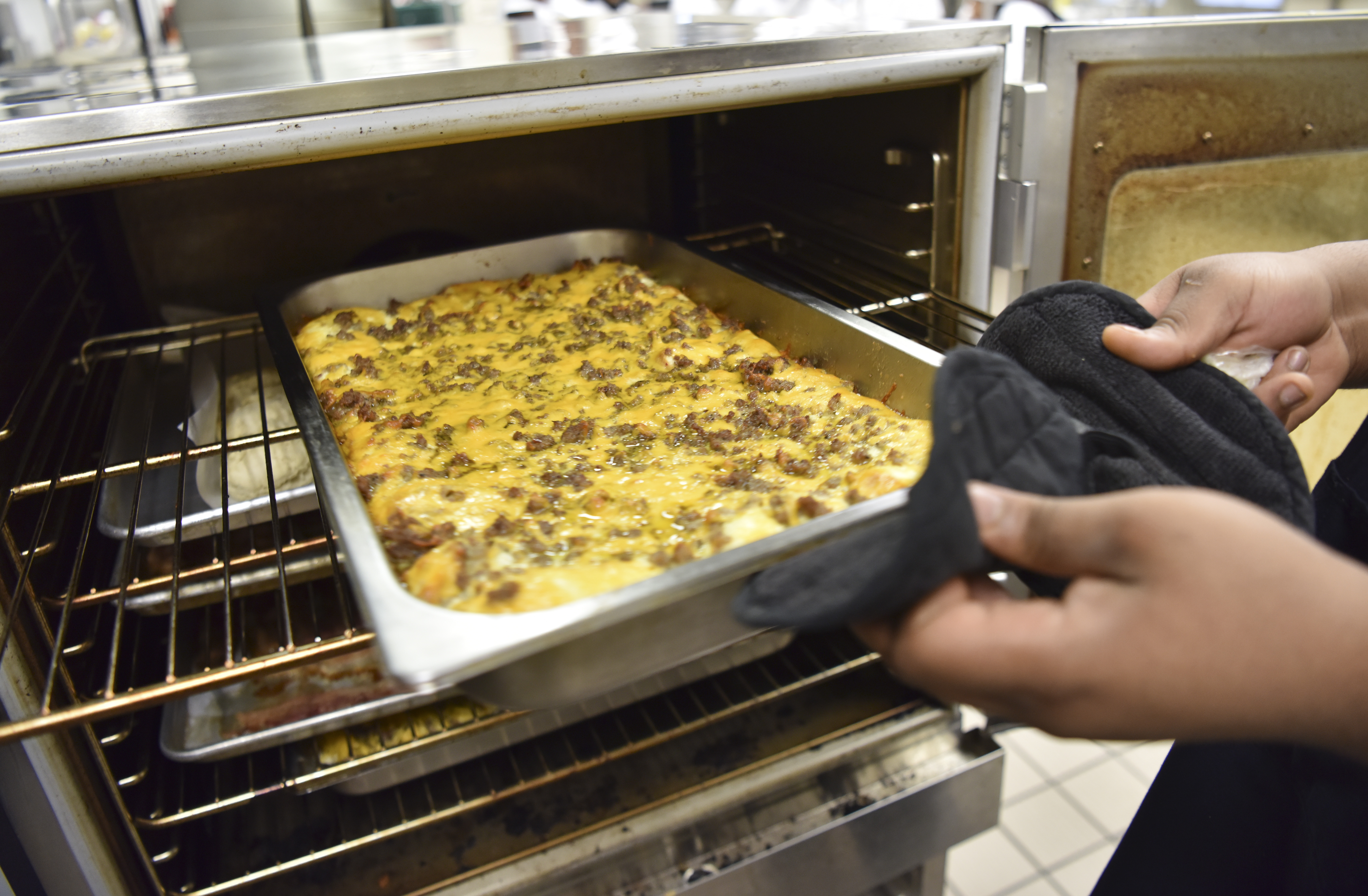 A breakfast casserole is ready and pulled from an oven in the kitchen. The Wenonah High School Culinary Arts program teaches students commercial kitchen skills. (Frank Couch, The Birmingham Times)