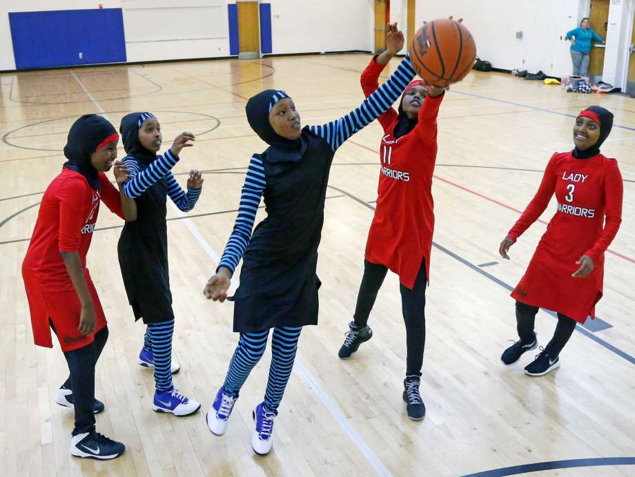 In this June 16, 2015, file photo, East African Muslim girls practice basketball in their new uniforms in Minneapolis. International basketball competitions could have players wearing religious headgear including hijabs and yarmulkes soon. Leaders of basketball’s governing body “issued a mandate” at their recent meeting for its playing rules committee to come forward with a proposal for headgear to be worn safely by athletes in competition, with the goal of approving the change at its meeting in May. FIBA announced the decision earlier this week. (Jim Mone, Associated Press, File) 