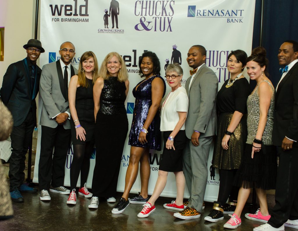 Attendees gather at the first Chucks & Tux fundraising gala in April 2016. Below, art from winners of a student shoe design contest. (Provided photo)
