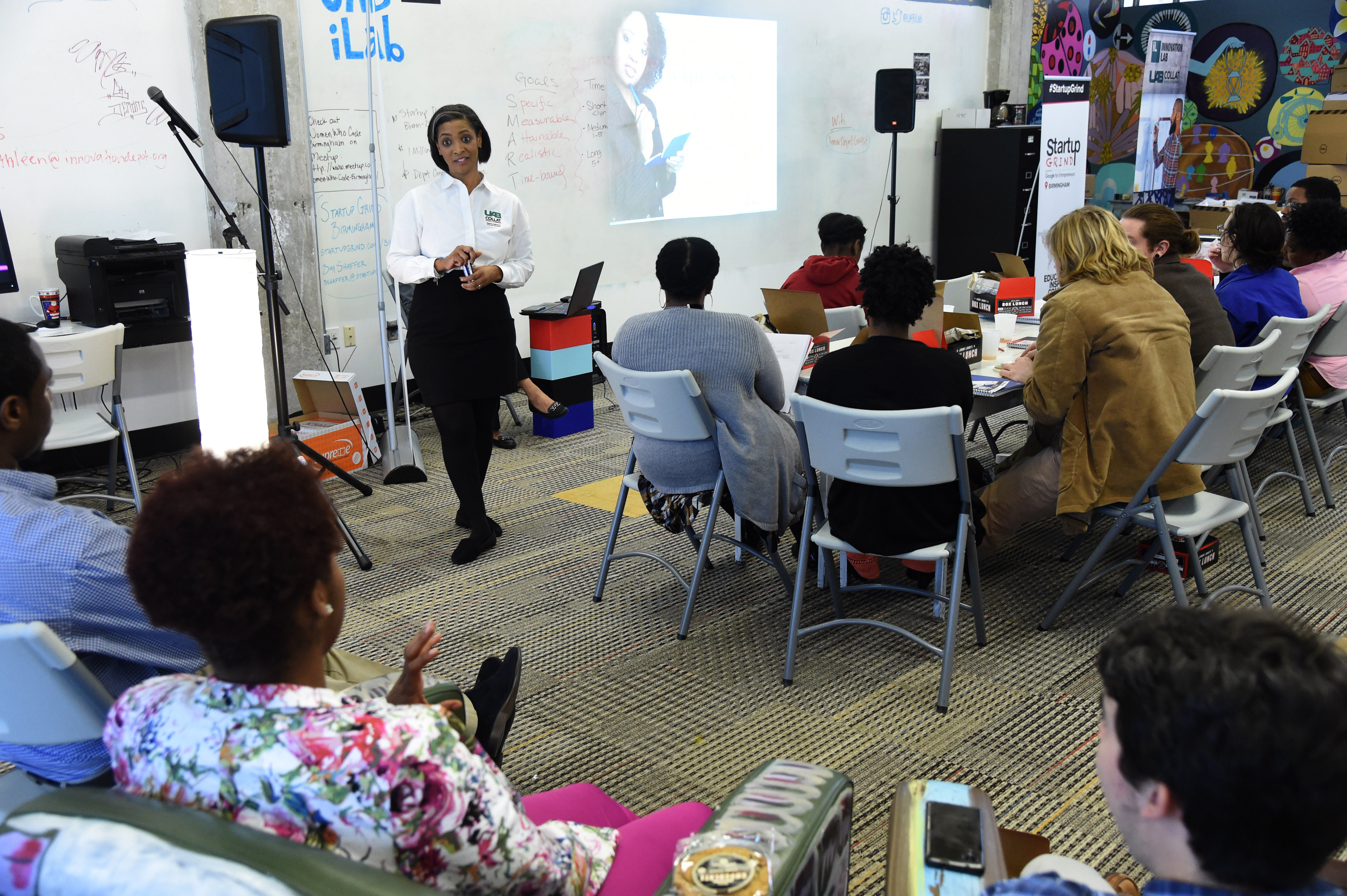Stephanie Yates, director of the Regions Financial Institute at the UAB Collat School of Business, leads a lunch time discussion about financial literacy as part of a partnership program to help students earn CompTIA A+ certification needed for entry-level jobs in the IT field at the Innovation Depot in Birmingham, Ala., Friday, Feb. 17, 2017. (Mark Almond, for The Birmingham Times)