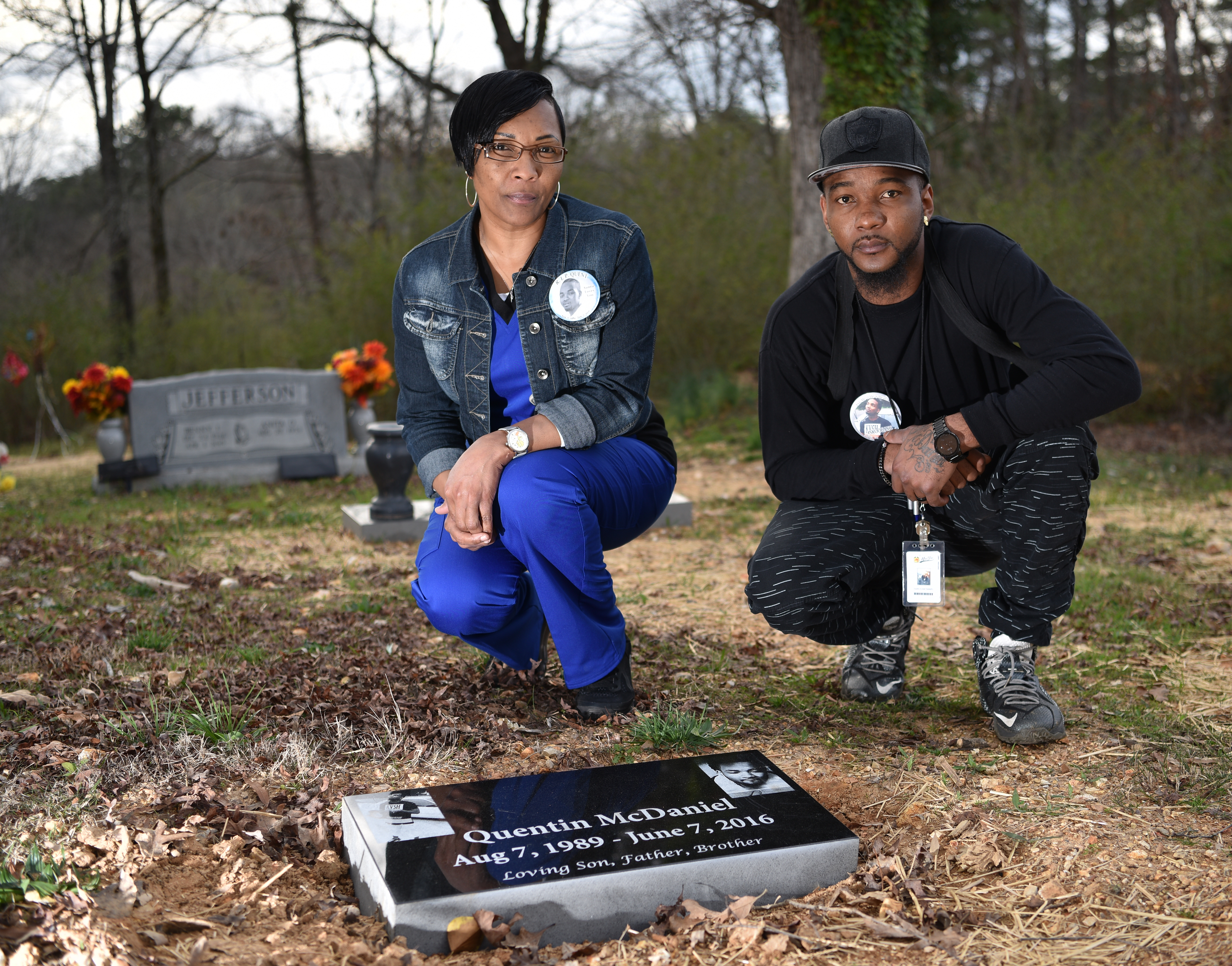 Quentin McDaniel died June 7, 2016 and his killer has not been arrested his mother Jacqueline Jones and older brother Darius McDaniel near his gravesite where they often visit. (Frank Couch / The Birmingham Times)