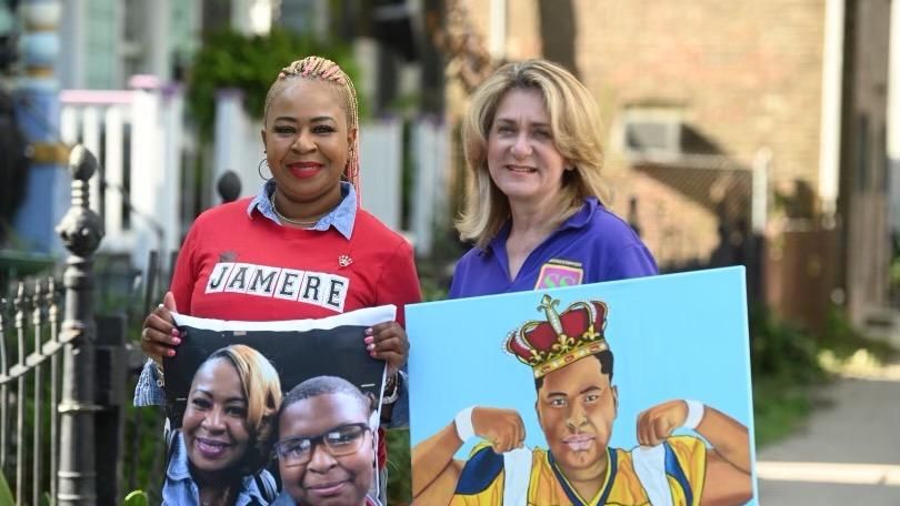 Ja' Mere Alfred's mother, LaRicha Rousell (left), and Crimestoppers Greater New Orleans president, Darlene Cusanza, holding images of Ja' Mere.  (Courtesy of LaRicha Rousell) 