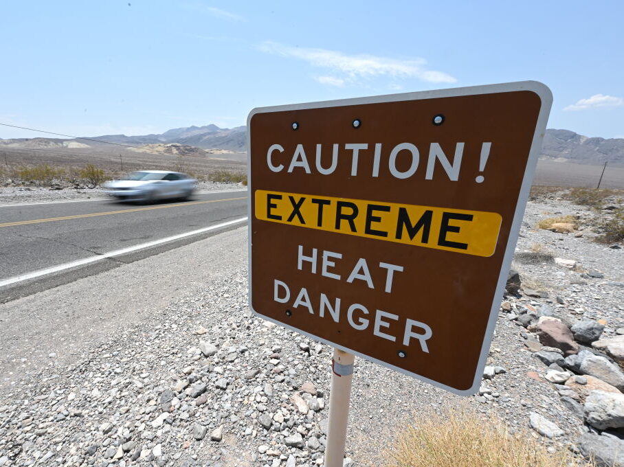 A warning sign posted alerts visitors of heat dangers on July 11, 2021, in Death Valley National Park, California. File photo. (David Becker/Getty Images)