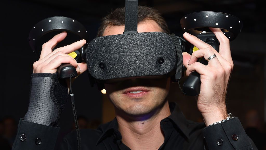 A guest wears a virtual reality (VR) headset at a Film Independent event in September 2019 in Playa Vista, California. VR enthusiasts can perform everyday tasks such as shopping, working or networking with a new app from Gravvity. (Amanda Edwards/Getty Images)
