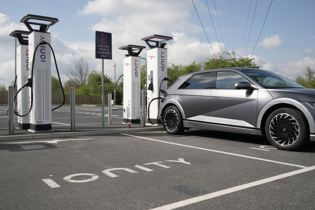 A Hyundai Ioniq battery electric vehicle (BEV) charges at an Ionity GmbH electric car charging station at Skelton Lake motorway service area on April 26, 2022 in Leeds, England. (Photo by Christopher Furlong/Getty Images)