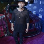 6. Actor Tahj Mowry poses with the 2015 Lincoln MKC on the red carpet