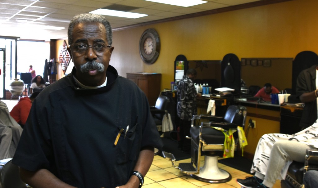 ​Willie Etheridge Jr. inside his downtown Birmingham barbershop. (Solomon Crenshaw Jr. photo).