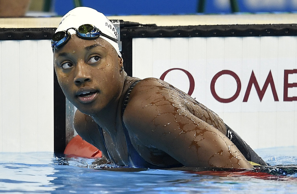 United States' Simone Manuel leaves the pool after competing in a women's 100-meter freestyle heat during the swimming competitions at the 2016 Summer Olympics, Wednesday, Aug. 10, 2016, in Rio de Janeiro, Brazil. (Martin Meissner, Associated Press)