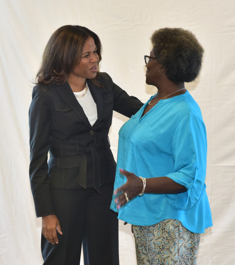 Birmingham City School Superintendent Dr. Kelley Castlin-Gacutan meets with Barbara Gilmore who retired after 39 years with the system.  (Frank Couch photos, The Birmingham Times)