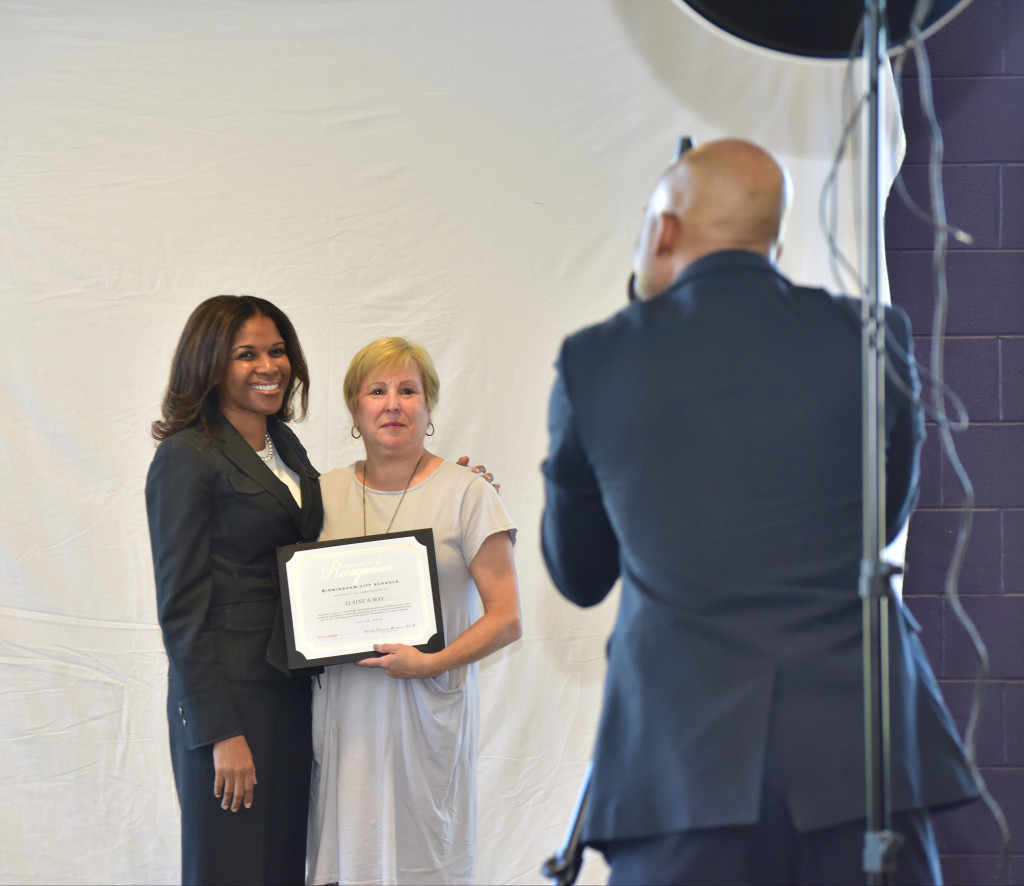 Dr. Castlin-Gacutan has a photo made with Elaine May who worked in the system for 36 years. (Frank Couch photos, The Birmingham Times)