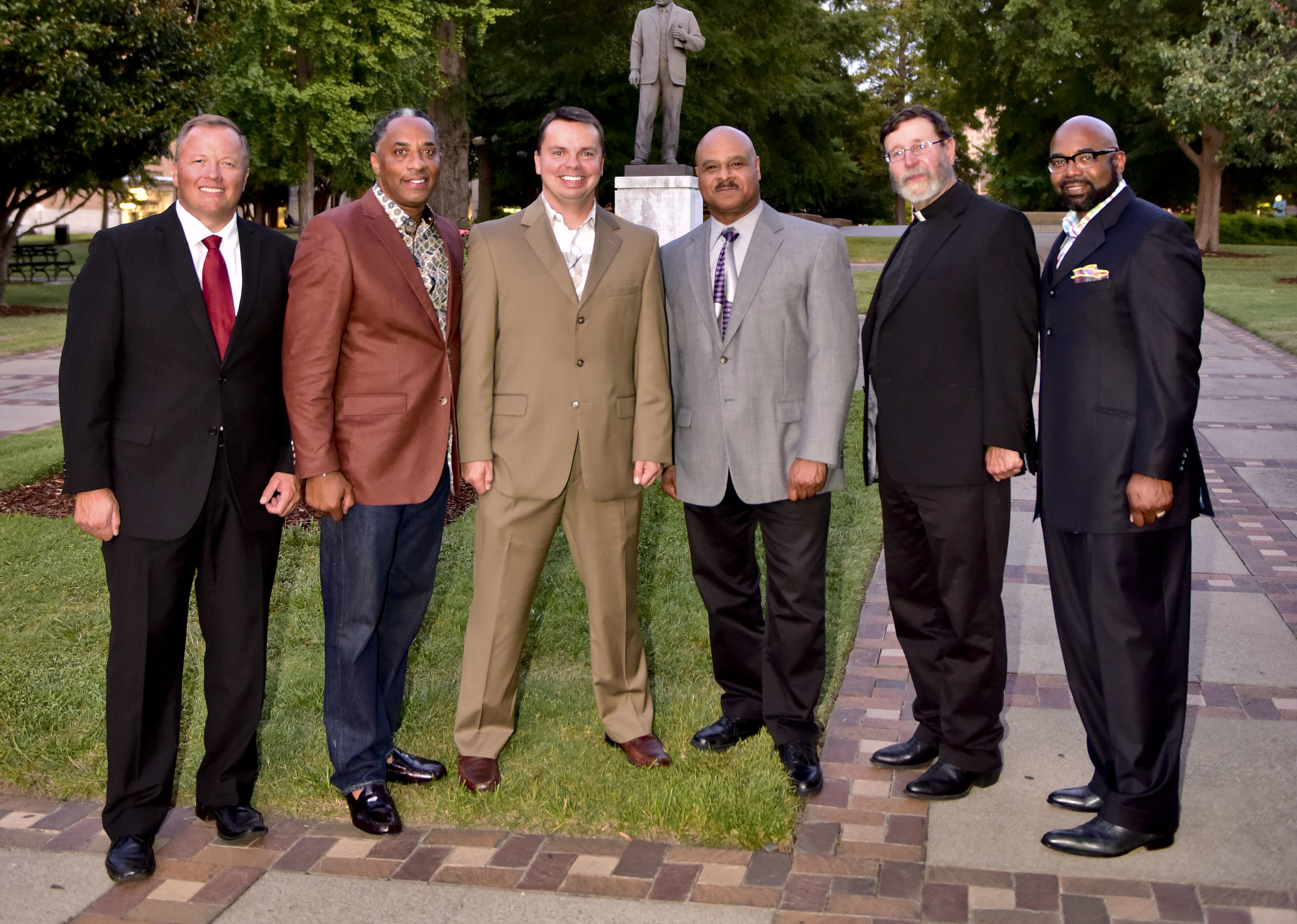 From left: Larry Ragland, Mike McClure, Sr., Jody Trautwein, Bishop Lowe, Jr., Fr. Mitchell Pacwa S.J. and Doug Taylor, members of the Gatekeepers Association of Alabama, gather in Kelly Ingram Park. (Frank Couch/The Birmingham Times)