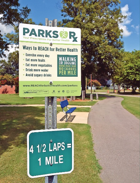 A Parks Rx sign hangs is shown at the West End Walking Trail. Similar signs will be installed in all Birmingham parks. (Mark Almond, special to the Times)