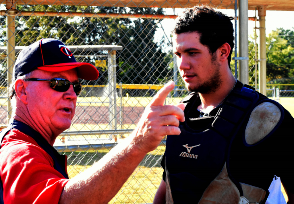 Jacob Bisharat (right) of Pleasant Grove High School gets tips from Minnesota Twins scout Jack Powell. (Solomon Crenshaw, Jr., Special to The Times)