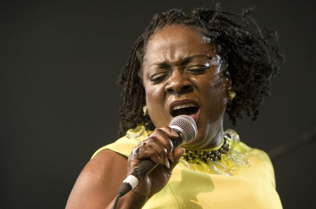 In this March 19, 2010 file photo, Sharon Jones and the Dap-Kings perform at the SPIN Party at Stubb's during the South by Southwest music festival in Austin, Texas. Jones, a big-voiced soul singer who performed with high energy onstage has died at age 60 in New York, after battling pancreatic cancer. Her representative Judy Miller Silverman says she died Friday, Nov. 18, 2016, at a Cooperstown hospital surrounded by her band, the Dap-Kings. (Jay Janner/Austin American-Statesman via AP, File)