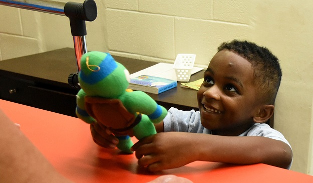 Demarcus Fox is elated with his stuffed animal. (Solomon Crenshaw Jr., special to The Times)