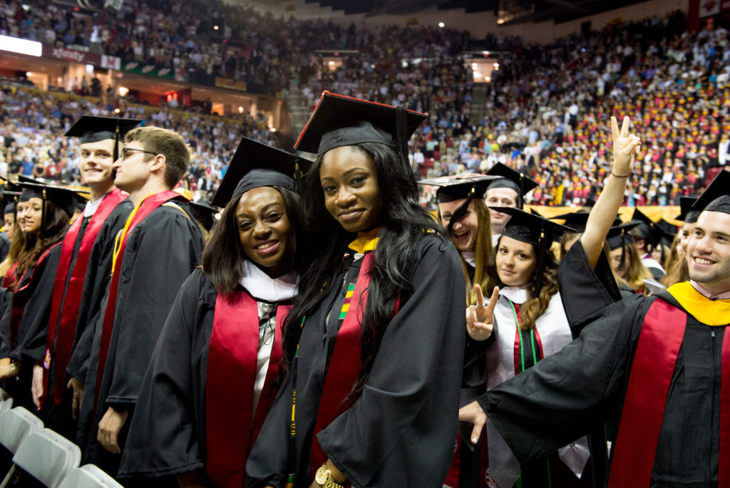 Graduates participate in commencement at the University of Maryland Graduation Ceremony. A Brookings' Economic Studies report found severe racial debt disparities for both black undergrads an those completing graduate college studies. (Jay Baker, Wikimedia Commons)