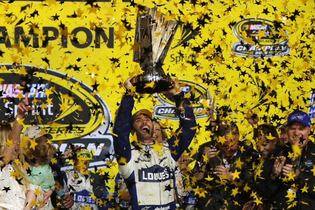 HOMESTEAD, FL - NOVEMBER 20: Jimmie Johnson, driver of the #48 Lowe's Chevrolet, celebrates with the NASCAR Sprint Cup Series Championship trophy in Victory Lane after winning the NASCAR Sprint Cup Series Ford EcoBoost 400 and the 2016 NASCAR Sprint Cup Series Championship at Homestead-Miami Speedway on November 20, 2016 in Homestead, Florida. Johnson wins a record-tying 7th NASCAR title. (Photo by Sean Gardner/NASCAR via Getty Images)
