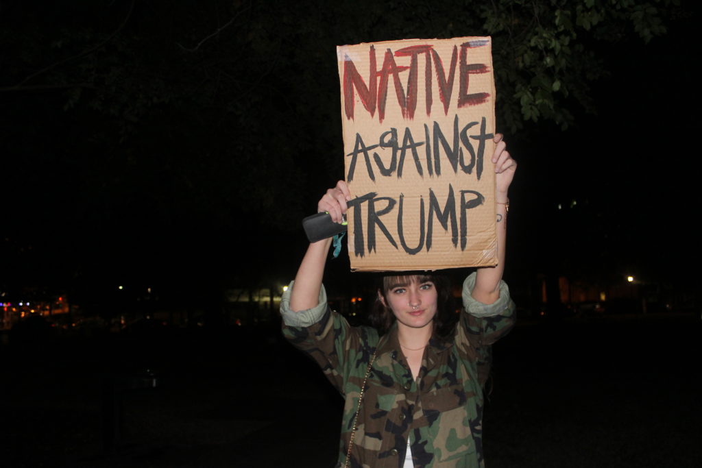 Storm Martin, 19, said she is protesting against Trump because of his ties to the Dakota Access Pipeline. As a Native American, Martin said she feels as if she wakes up in a country that hates her. (Ariel Worthy, The Birmingham Times)