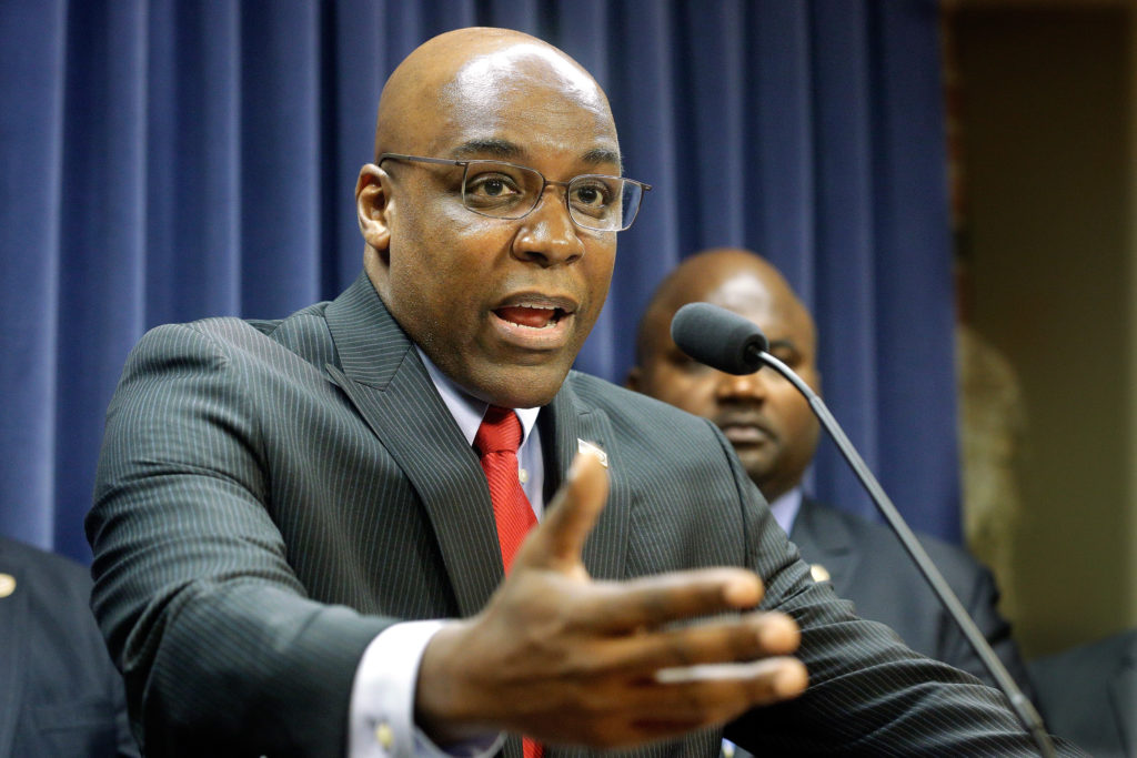 In this Aug. 12, 2015 file photo, State Sen. Kwame Raoul, D-Chicago, speaks during a news conference at the Illinois State Capitol, in Springfield, Ill. Illinois legislators are facing mounting pressure to lengthen sentences on repeat criminals who return to the streets and contribute to Chicago's violence after serving only a portion of their prison terms. Raoul, is preparing legislation to impose longer sentences on defendants who've committed a gun-related crime before.(Seth Perlman, Associated Press, File)