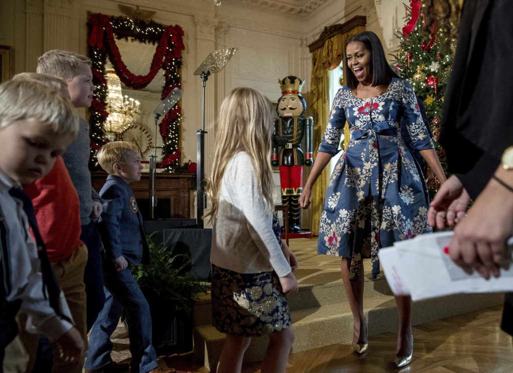 First lady Michelle Obama, right, greets children of military families in the East Room of the White House during a preview of the 2016 holiday decor (Andrew Harnik, Associated Press)