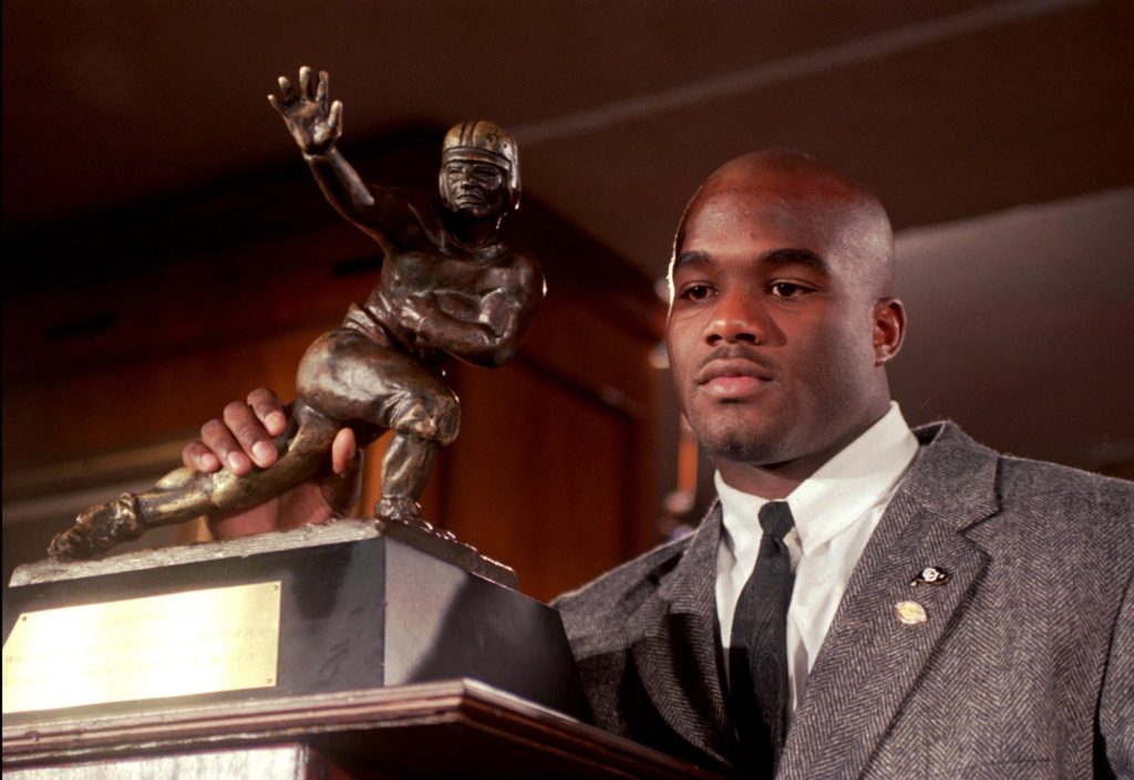 In this Dec. 10, 1994, file photo, Colorado's Rashaan Salaam poses with his 1994 Heisman Trophy at the Downtown Athletic Club in New York. Authorities say Rashaan Salaam has been found dead in a park in Boulder, Colo. The Boulder County coroner’s office said Tuesday, Dec. 6, 2016, that it is still investigating the death of 42-year-old Salaam. (AP Photo/Adam Nadel, File)