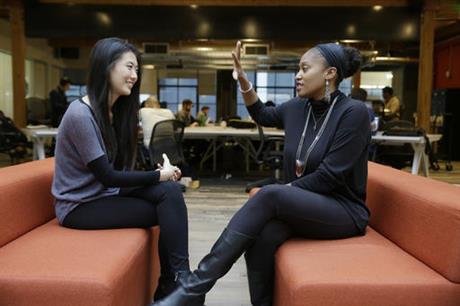 In this Tuesday, Jan. 3, 2017, photo, Aniyia Williams, founder and CEO of Tinsel, right, talks about program placement with Kara Lee, at the offices of Galvanize in San Francisco. Williams says she has made sure to hire women as well as underrepresented minorities. Tinsel makes tech jewelry targeted at women. (Eric Risberg, Associated Press)