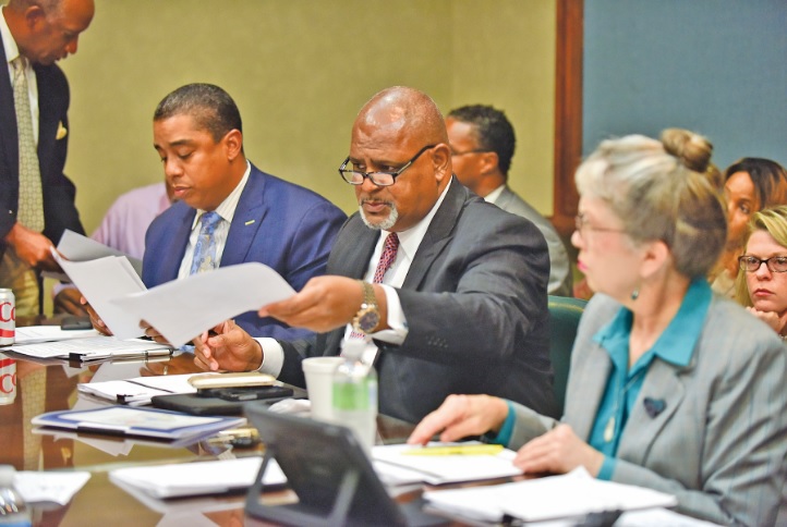 Council members James “Jay” Roberson, Steven W. Hoyt, and Valerie Abbott look over a handout from the mayor in August during the Birmingham City Council’s Budget and Finance committee hearing. Municipal elections will take center stage in the city this year. (Frank Couch, special to The Times)