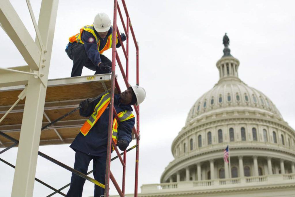 In this Dec. 8, 2016, file photo, construction continues for the Inauguration and swearing-in ceremonies for President-elect Donald Trump on the Capitol steps in Washington. (Pablo Martinez Monsivais, Associated Press) 