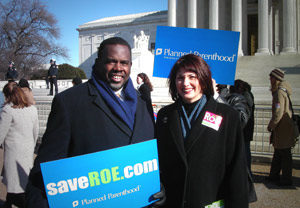 Rep. Albert Wynn (left) joins Gloria Feldt (right), President of the Planned Parenthood Federation of America, on the steps of the Supreme Court, to rally in support of the pro-choice movement on the Anniversary of Roe v. Wade. (Official website of US Congressman Albert Wynn/Public domain)