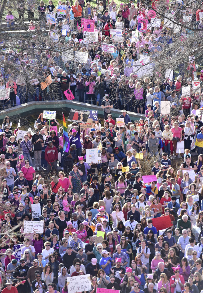 The crowd swelled as speakers rallied the crowd for over an hour. Thousands gathered in Kelly Ingram Park and marched in the Women's March Alabama Saturday January 21, 2017 in Birmingham, Alabama. They listened to speakers, sang, chanted and displayed signs before they marched from the to City Hall and back to the park arriving moments after the last of the marchers departed. (Frank Couch / The Birmingham Times)