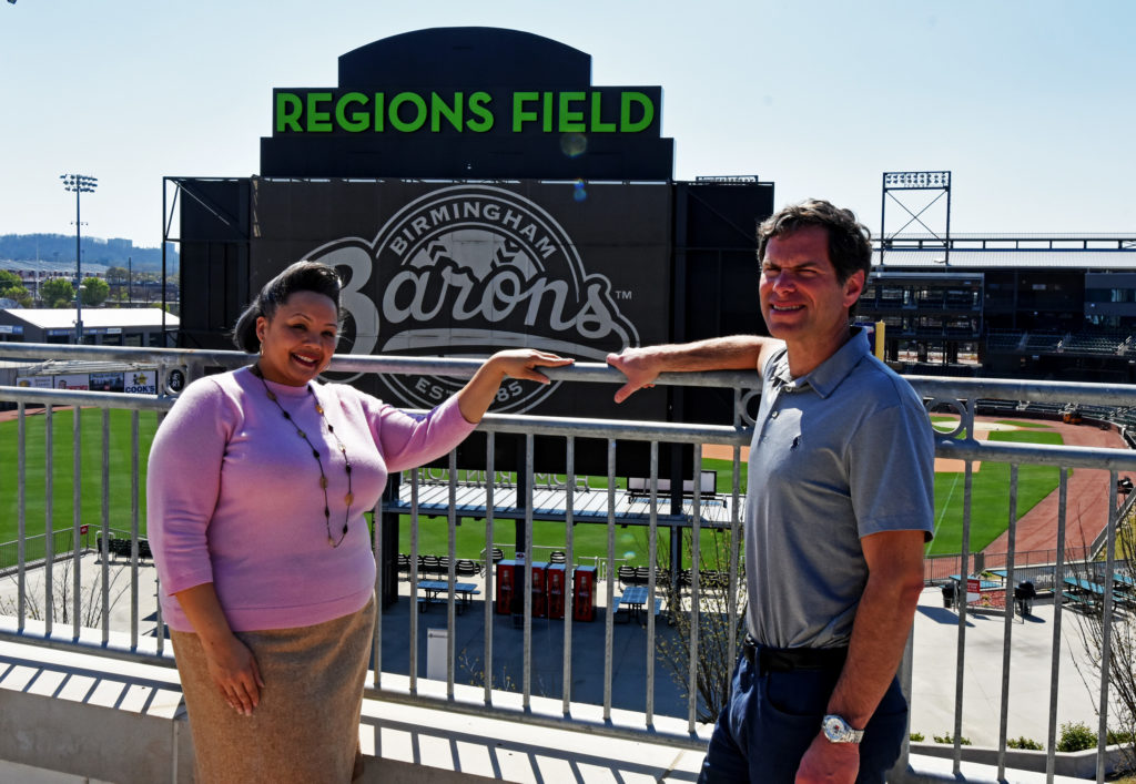 Natasha Rogers and Jonathan Nelson stand along the rooftop of the Negro Southern League Museum overlooking neighboring Regions Field. Rogers is executive director of the museum. Nelson is general manager of the Birmingham Barons, the minor league ballclub that plays at Regions Field. (Solomon Crenshaw Jr., for The Birmingham Times)