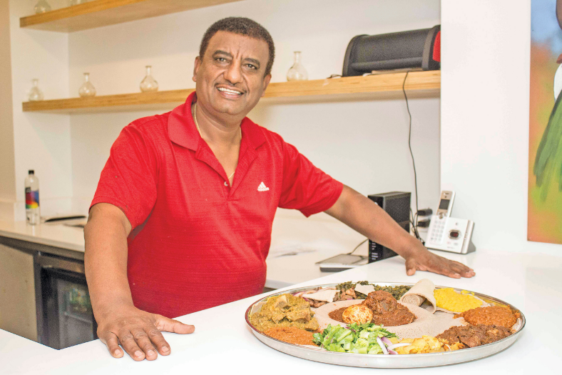 Amanshwa Takele is the owner of Ghion Cultural Hall. Takele, who also owns a Ghion location in Atlanta, said Ethiopian food is prepared healthier. (Reginald Allen, for The Birmingham Times)