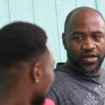 Duane Holmes Sr. talks one-on-one with a fellow