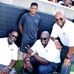 Michael Maye, seated left, with his son Phillip Maye, and teammates Kevin Fields, Houston Markham III