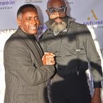 Art Franklin with a model from the purple carpet