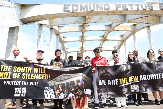March attendees go across the bridge